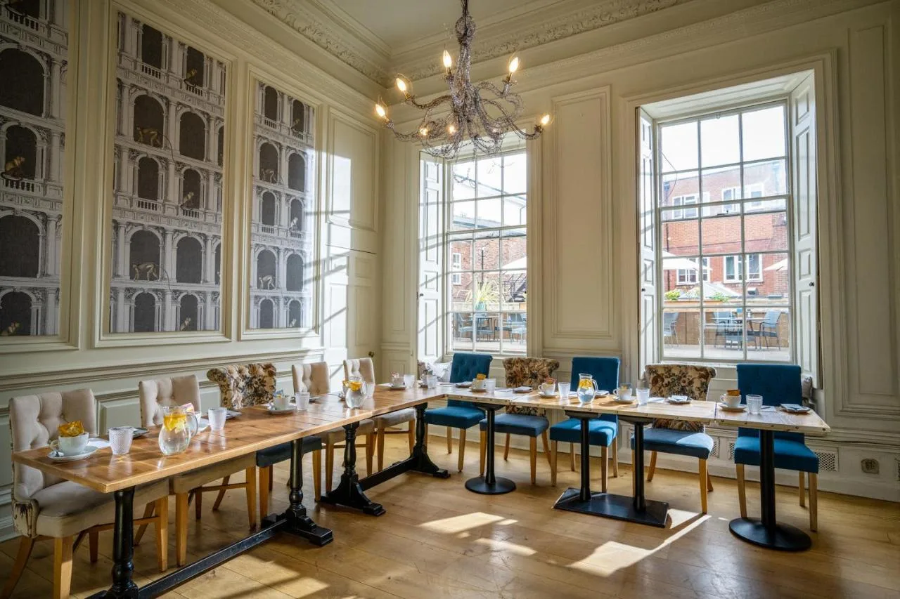 A large dining room with a long table and chairs at Judge's Lodging in York